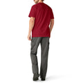 Man wearing burgundy short-sleeve pocket t-shirt and gray cargo pants, shown from back view.