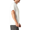 White short-sleeve t-shirt with chest pocket, shown on male model in side profile view.