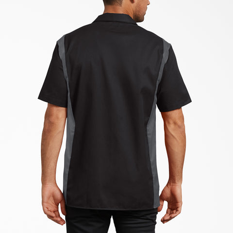 Black and gray short sleeve work shirt with contrasting side panels, shown from back view on male model.