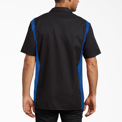 Black and blue short sleeve work shirt with color-blocked sides, shown from back view on male model.