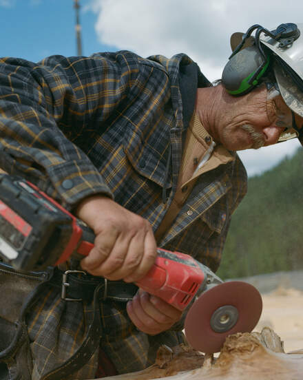 Man Cutting Wood Wearing Dickies Clothing