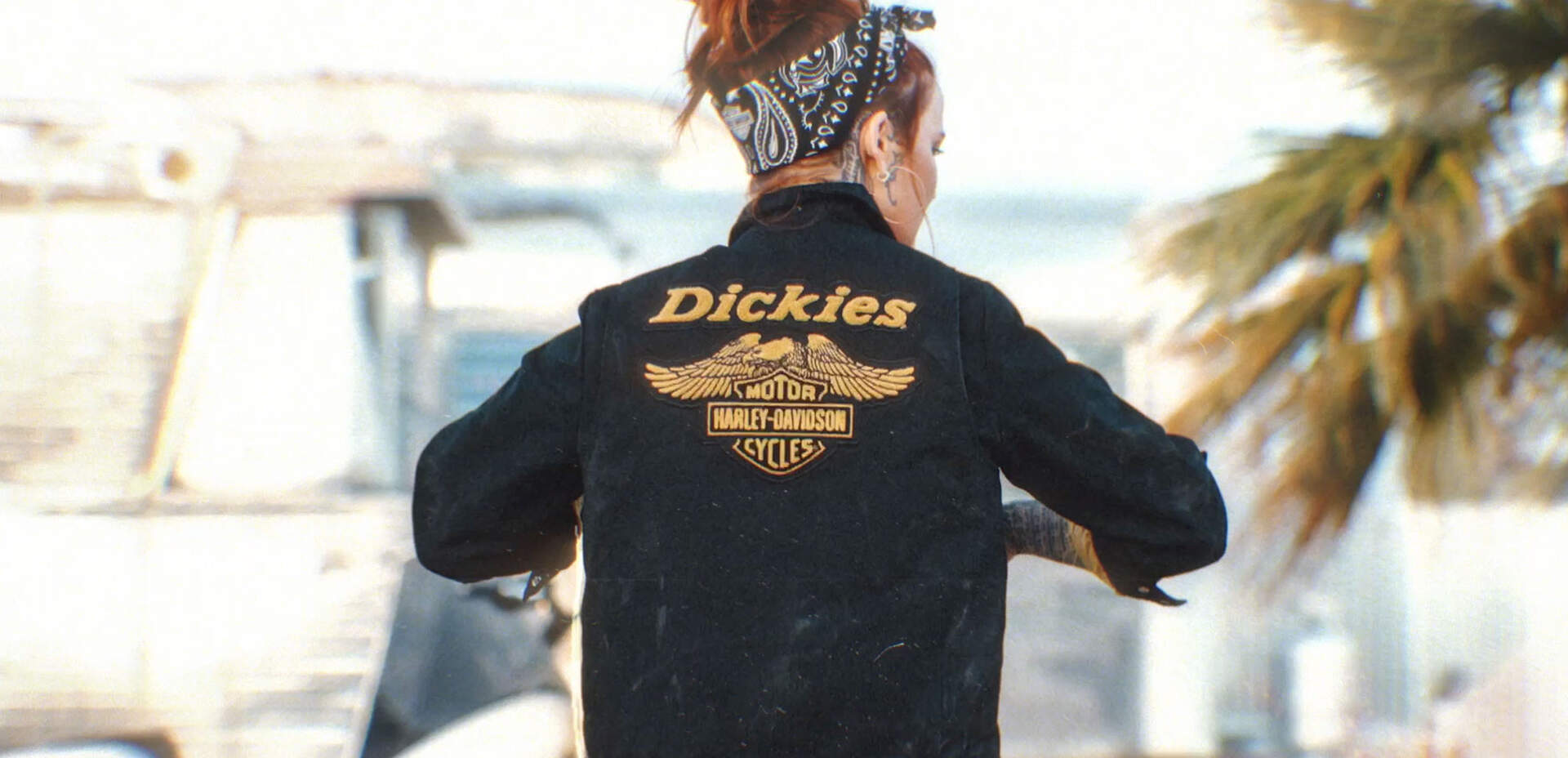 Woman with bandana wearing Dickies x Harley black jacket