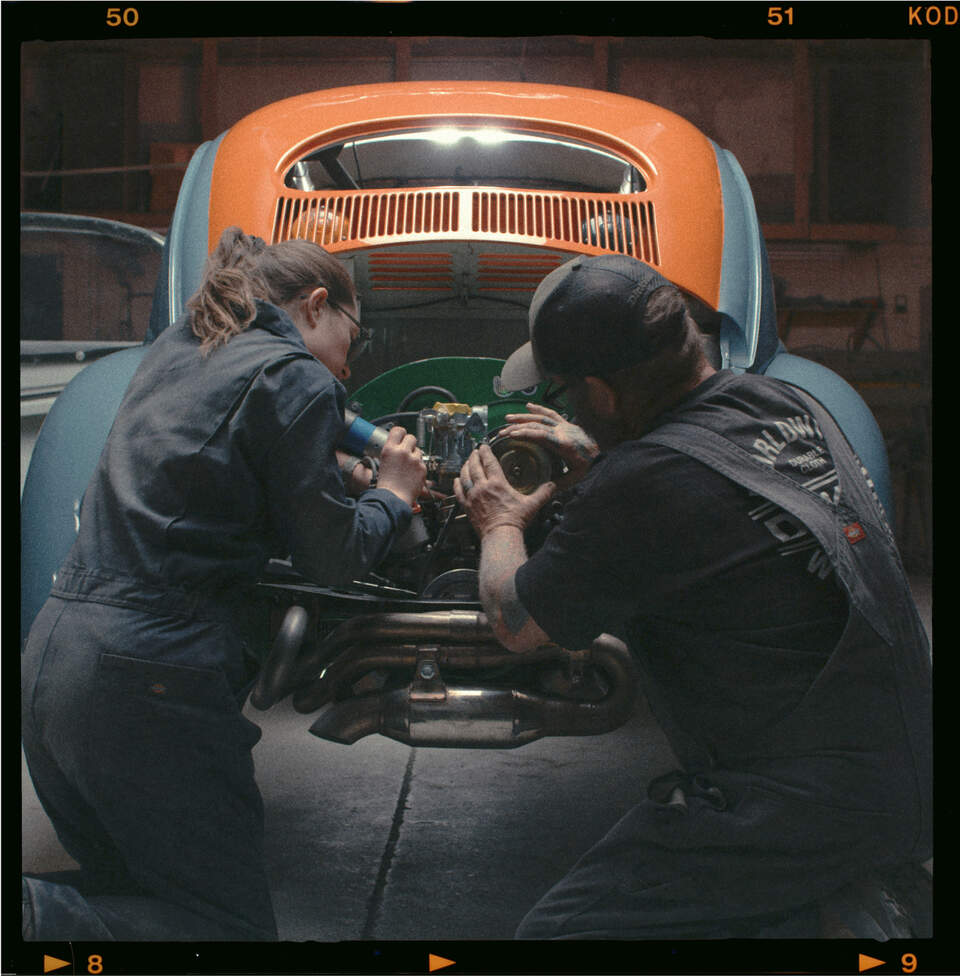 John and his daughter working on the car