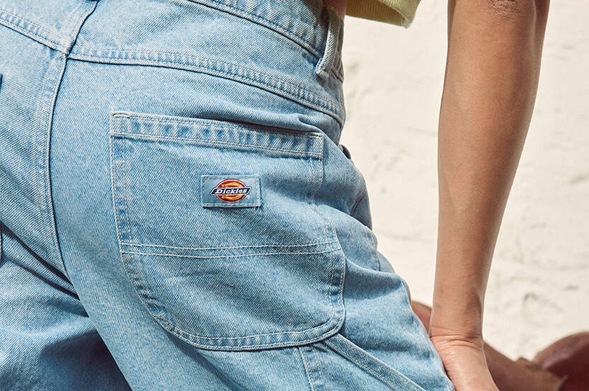 Close up of Dickies logo patch on back pocket of woman in Dickies Herndon jeans