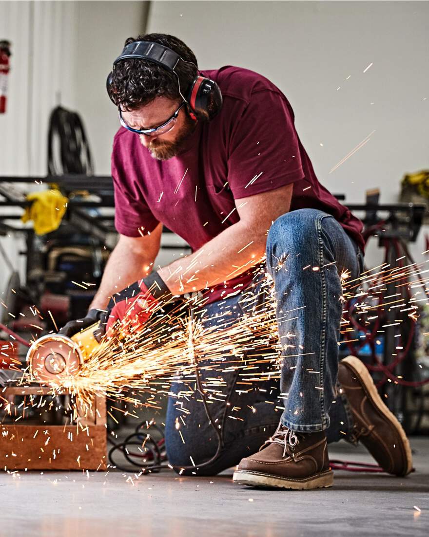 Man wearing ear protection using heavy machinery