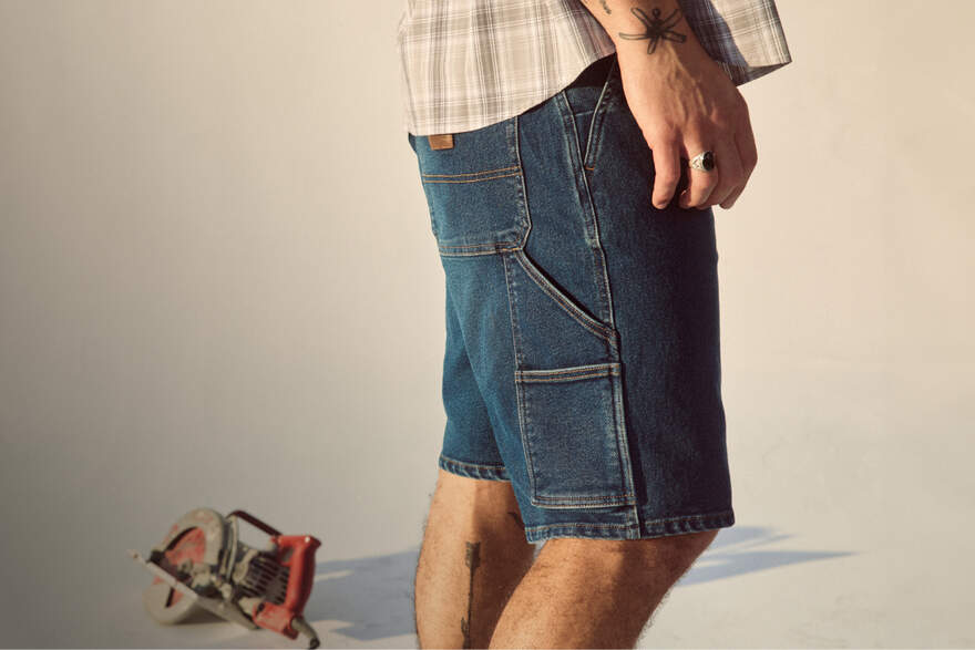Men wearing Dickies denim shorts at work site
