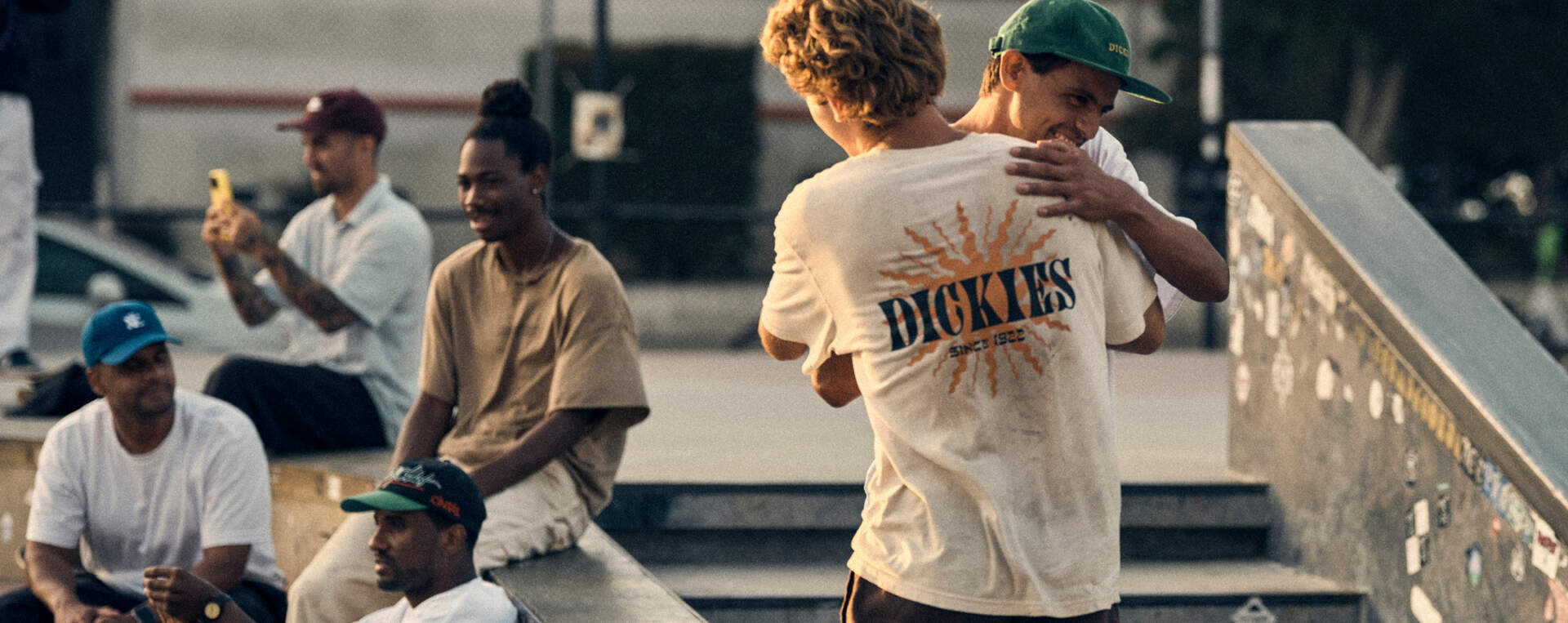 Workers hugging in skate park