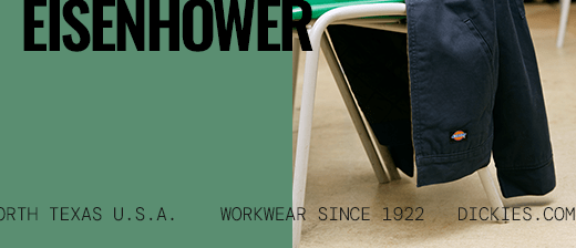 several dickies work shirts hanging on a wall