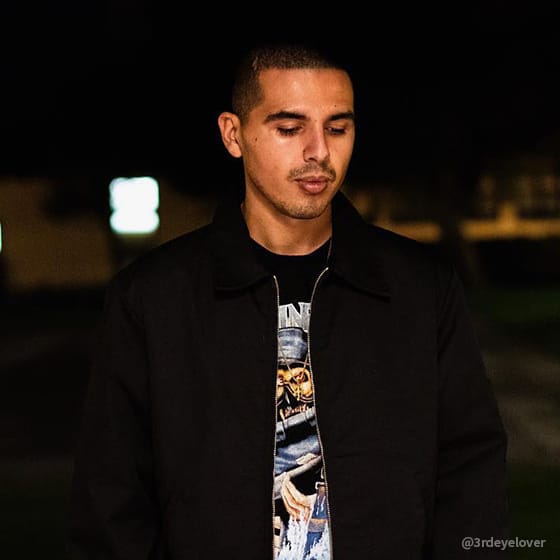 Man looking down in black jacket
