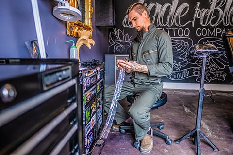 Sven is prepping a tool for his day ahead and is looking pretty cool doing it in those coveralls.