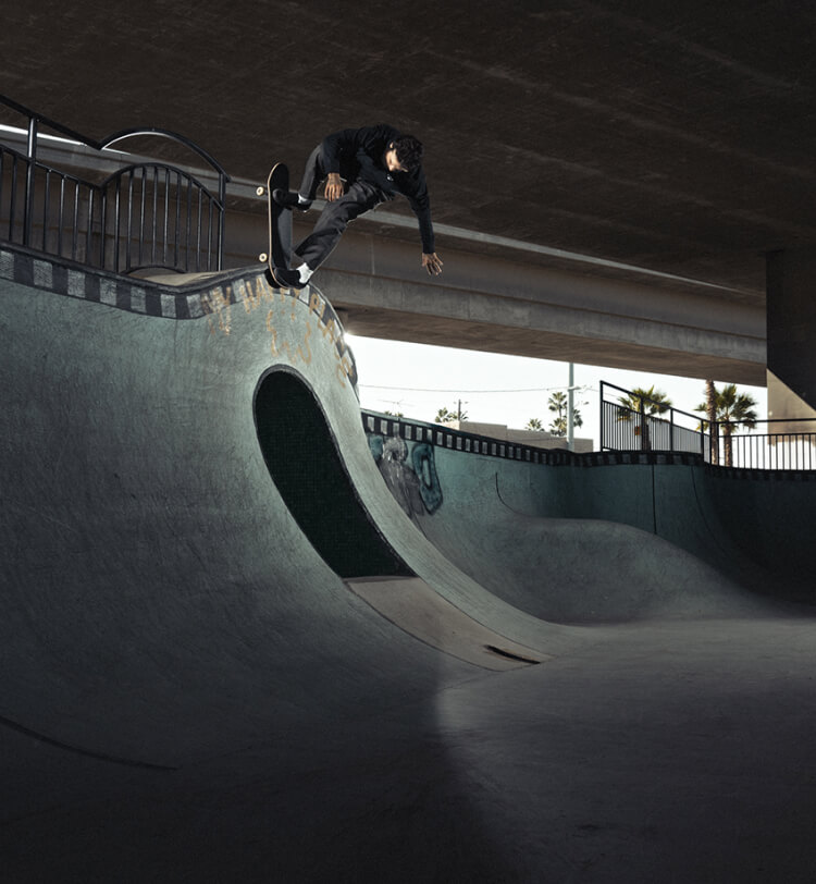 Ronnie Sandoval skateboarding on a quarter pipe.