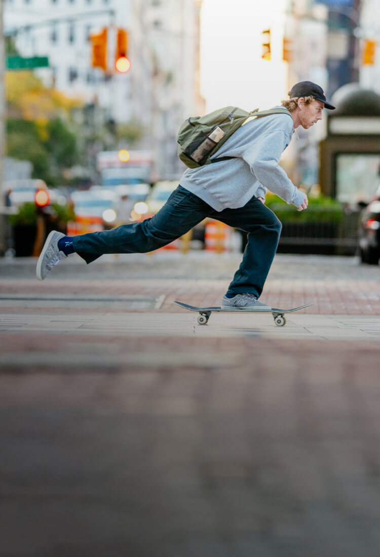 Jake Hayes skateboarding in an urban setting.