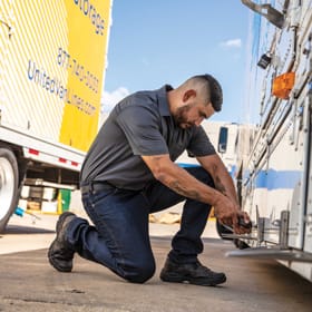 Man fixing truck.