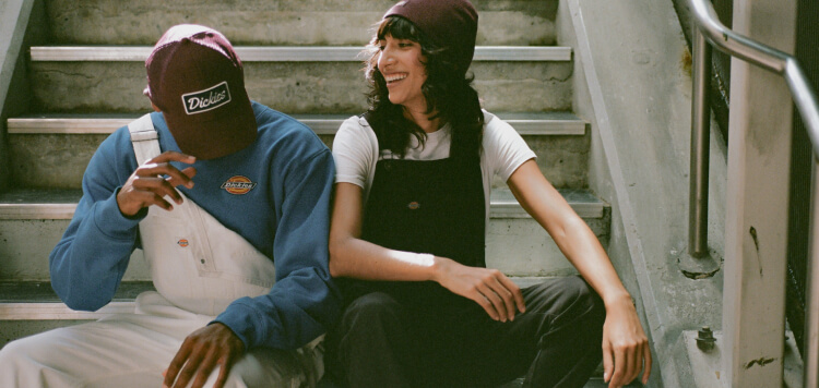 A man and woman sitting on stairs