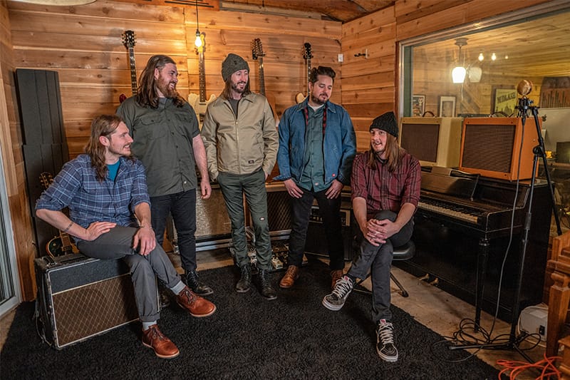 Members of the Matthew McNeal Band, Matt, Andre, Joey, McKenzie and Aaron, gather in the sound studio.