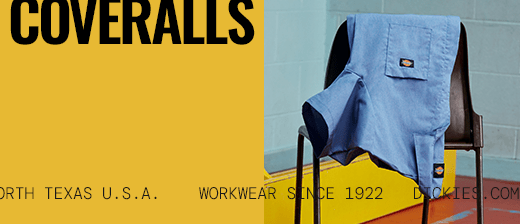 several dickies work shirts hanging on a wall