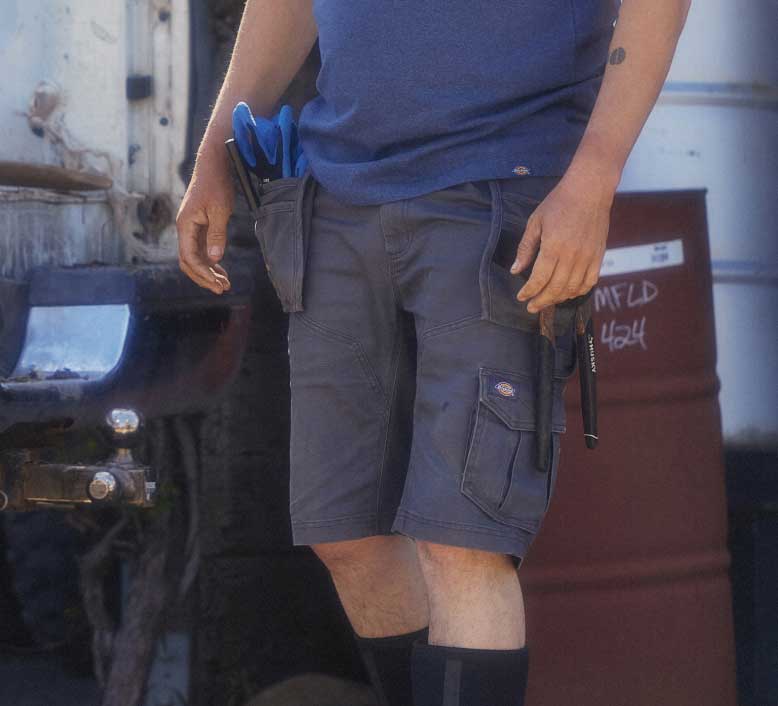 A closeup of work shorts pockets.