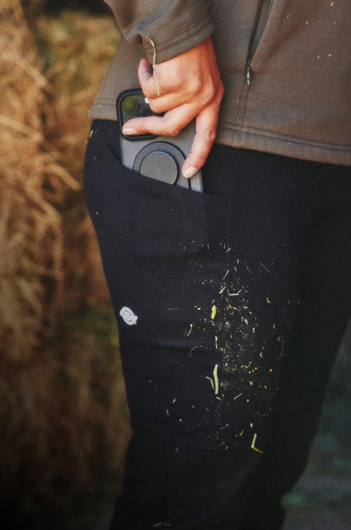 Close up of women wearing legging with cell phone pocket.