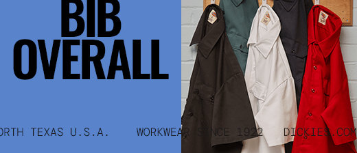 several dickies work shirts hanging on a wall