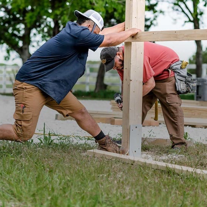 man installing a fence