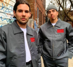 two men wearing eisenhower jackets