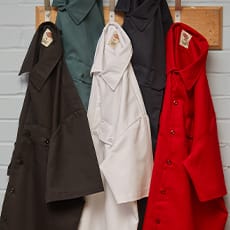 several dickies work shirts hanging on a wall