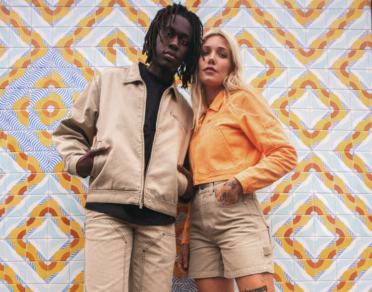 A man and woman looking at the camera.