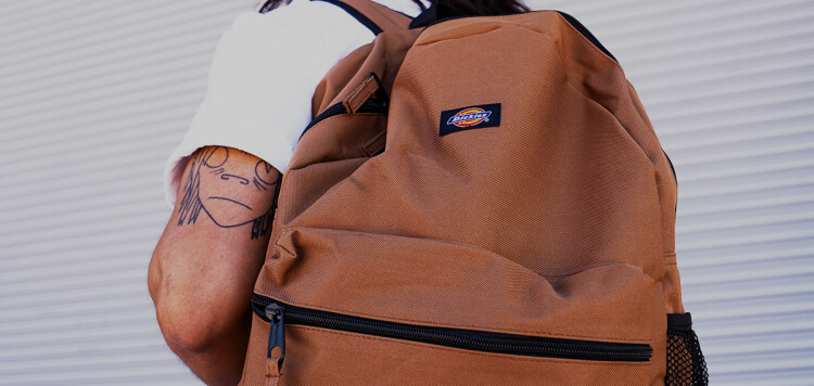 a child wearing a brown backpack
