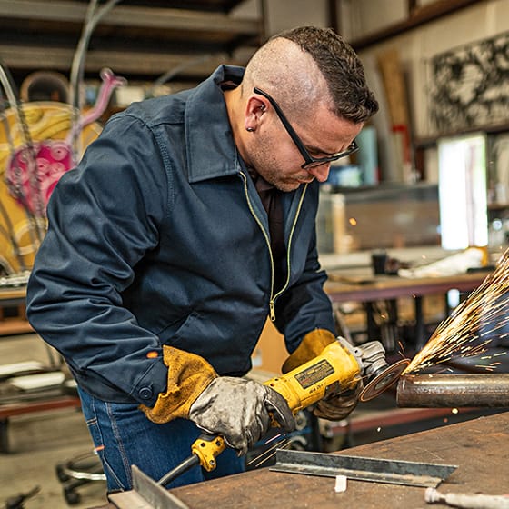 Man welding in a work shop