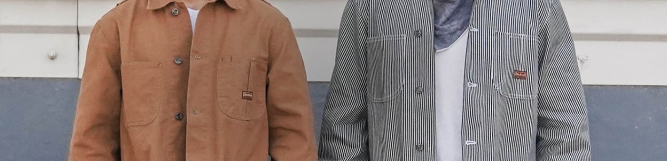 two jackets being worn by people