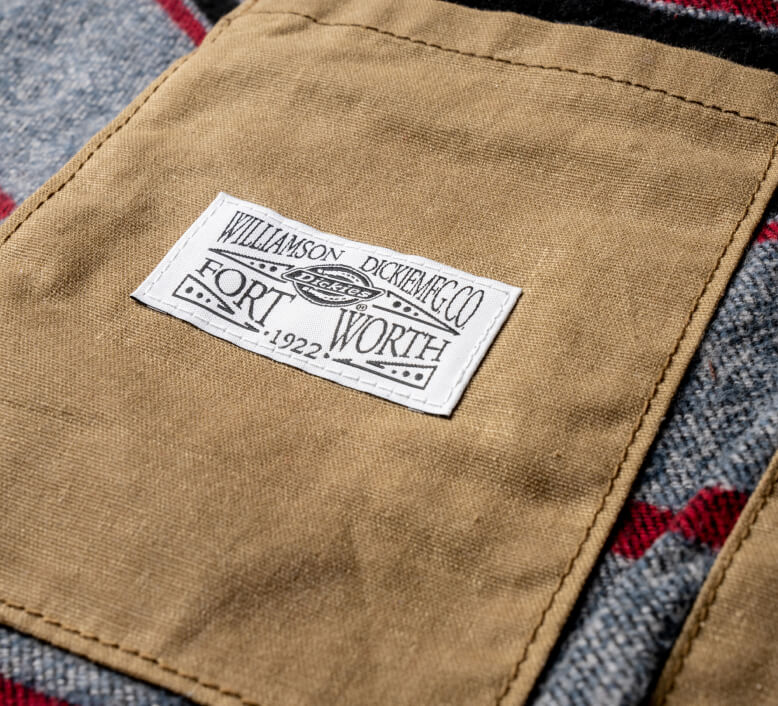 A close up of an inside pocket of a waxed jacket.