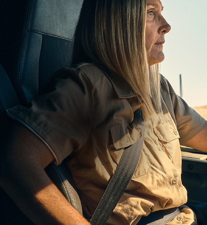 A woman driving a vehicle